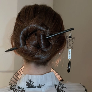 Detail of butterfly tassel hairpin used in traditional Chinese bun hair styling