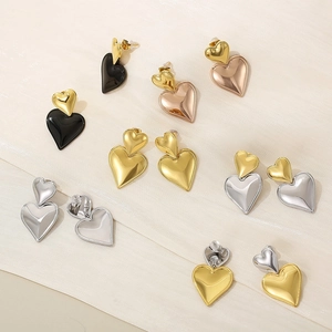 Minimalist double heart stud earrings in gold, silver, and black polished stainless steel