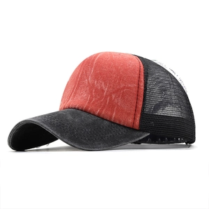 Detail of red and black distressed denim trucker hat with breathable mesh back
