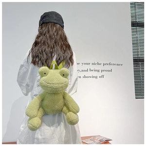 Rear view of a model wearing a cute green plush frog backpack with adjustable straps
