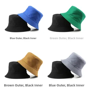 Detail view of double-sided cotton bucket hats in blue, green, brown, and grey colors