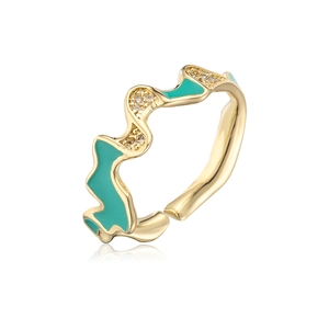 Detail of 18K gold wave ring with turquoise enamel drip and sparkling zircon stones
