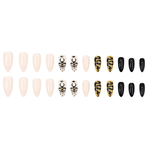 24-piece almond press-on nails with snake, eye, and moon patterns in mixed colors