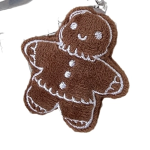 Cute brown plush gingerbread man keychain with white embroidery and metal clasp