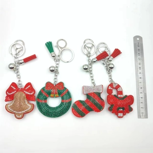 Detailed view of Christmas rhinestone keychains with tassels and measuring ruler