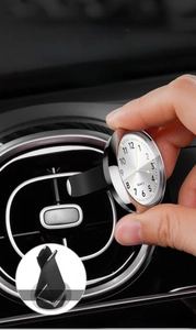 Installing the luminous 40mm quartz car clock onto the dashboard air vent outlet