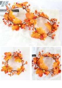 Detailed view of flexible fall garland with maple leaves, pumpkins and berries for autumn decor