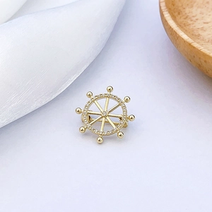 Exquisite golden helm brooch with micro-pave crystals shown in a high-quality macro detail