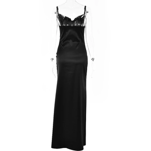 Rear view of sleek black satin evening gown featuring an open back and high slit detail