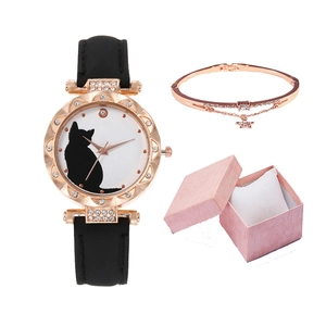 Detail of rose gold cat motif quartz watch with rhinestone bezel and star pendant bracelet