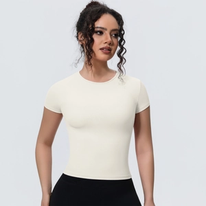 Detailed front view of a slim-fit crewneck sports top in cream white with breathable fabric