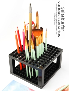Macro view of 96-slot square plastic holder for watercolor brushes and pencils