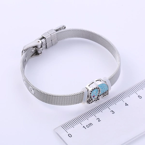 Minimalist silver elephant charm mesh bracelet showing 1cm width measurement on ruler