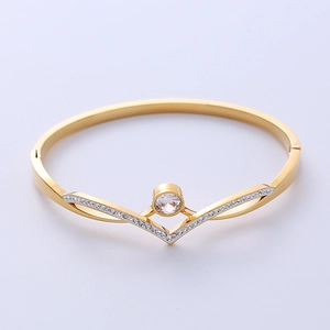 Gold-plated V-shaped hinged bangle for women with sparkling zircon accents and a center stone
