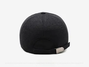 Rear view of wool baseball cap showing adjustable black strap and matte metal buckle