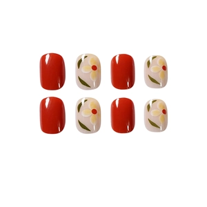 Short square-oval press-on nails set with red gloss and hand-painted daisy patterns