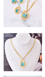 Detailed views of gold jewelry set with oval turquoise stones in open globe frames