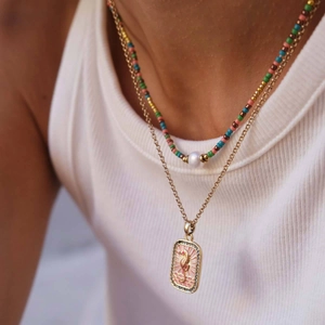 Layered beaded necklace with pearl and gold seahorse tarot card pendant for women