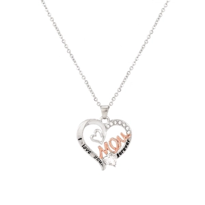 Close-up of heart pendant with MOM lettering and sparkling heart-shaped gemstone