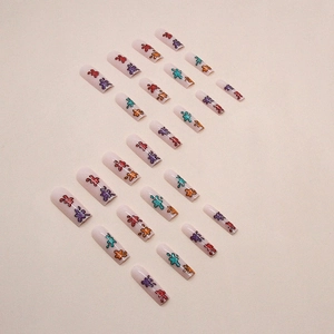 Colorful glitter splatter graffiti on long coffin press-on nails with matte nude base
