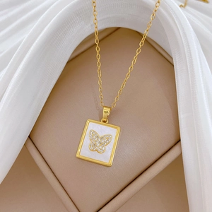 Elegant gold titanium necklace featuring a square shell pendant with butterfly and crystals