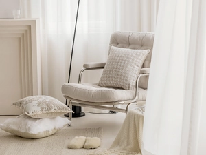 French chic beige cushion covers and white faux fur pillows in a cozy living room setup