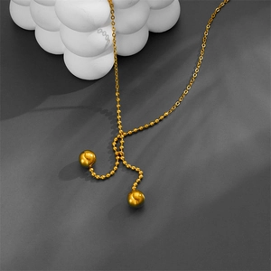 Titanium steel sweater chain with double gold beads on a minimalist metallic ball chain