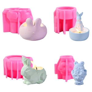 Detailweergave van vier 3D konijn siliconen mallen en afgewerkte pastel kaarsen