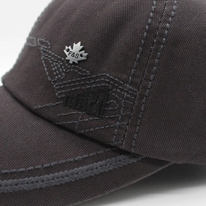 Detail of cotton baseball cap featuring 1921 embroidery and silver maple leaf metal buckle