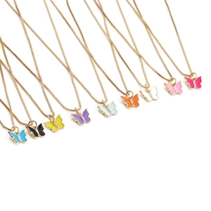 Nine colorful enamel butterfly necklaces in gold finish displayed on white background