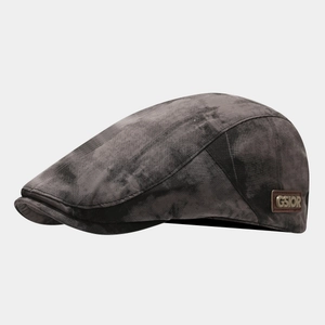 Close-up of retro dark grey ivy cap showing washed fabric texture and GSIOR leather tag