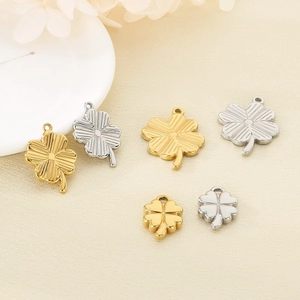 Polished stainless steel four-leaf clover pendants in gold and silver, assorted sizes
