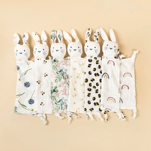Detail view showing six assorted baby security blankets with cute rabbit ears and patterns