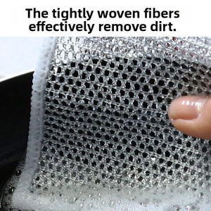 Macro shot of silver wire dishcloth showing dense mesh texture and foam for deep cleaning