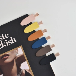 6-piece set of matte colorful hair clips with rose gold metal base on magazine