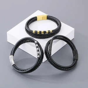 Close-up of three men's multilayer braided leather bracelets with diverse magnetic clasps