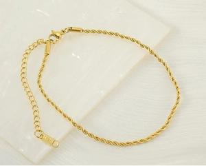 Detail of 18k gold plated stainless steel twist chain anklet with lobster clasp
