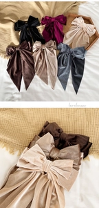 Assorted velvet bow hair clips with long ribbons in multiple elegant colors