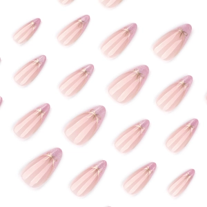 Pink gradient almond press-on nails with silver glitter tips and golden bow accents