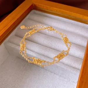French vintage double-layered gold bracelet with hollow sunflower charms on velvet