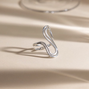 Minimalist adjustable stainless steel open ring with fluid curved lines and silver finish