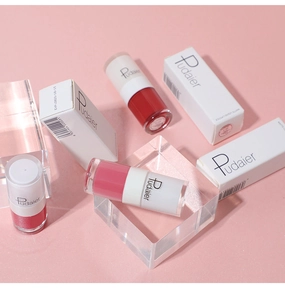 Artistic layout of three matte liquid lipstick shades with matching gift boxes