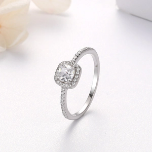 Close-up of a S925 sterling silver ring with square-cut stone and pavé set diamonds