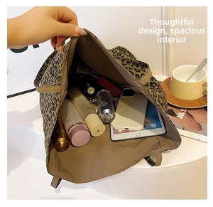Detailed view showing the large interior capacity of the leopard print canvas tote bag