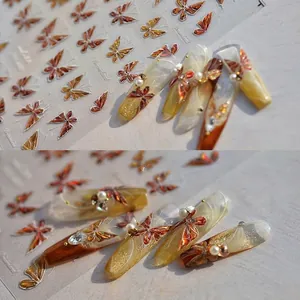 Detail of butterfly nail stickers with 3D pearls and rhinestones on jelly nail base