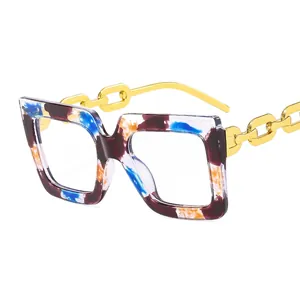 Modern square tortoise shell glasses with stylish gold chain metal temples on white