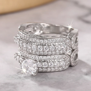Macro shot of a sparkling six-prong round zircon ring set with matching eternity bands