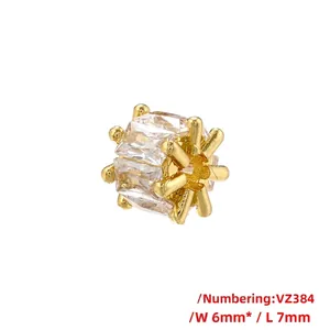 Macro shot of 18K gold plated 6x7mm barrel bead with baguette-cut zircon inlay