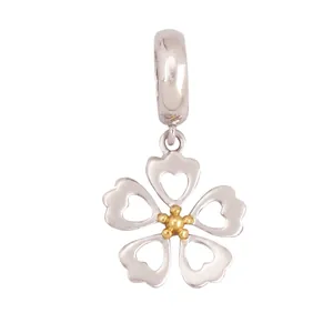 Silver flower pendant with gold center, showing size dimensions and hollow heart petals
