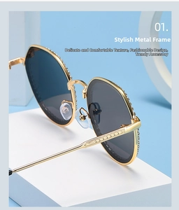 Detail of gold metal frame sunglasses with rhinestone accents and vintage temples
